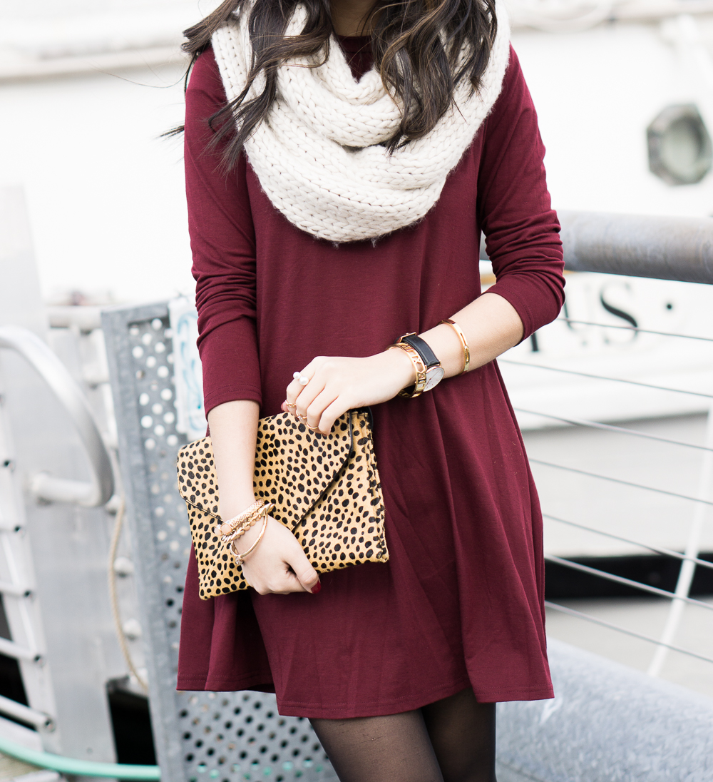 burgundy skater dress, infinity cable knit scarf, cheetah print clutch, casual outfit