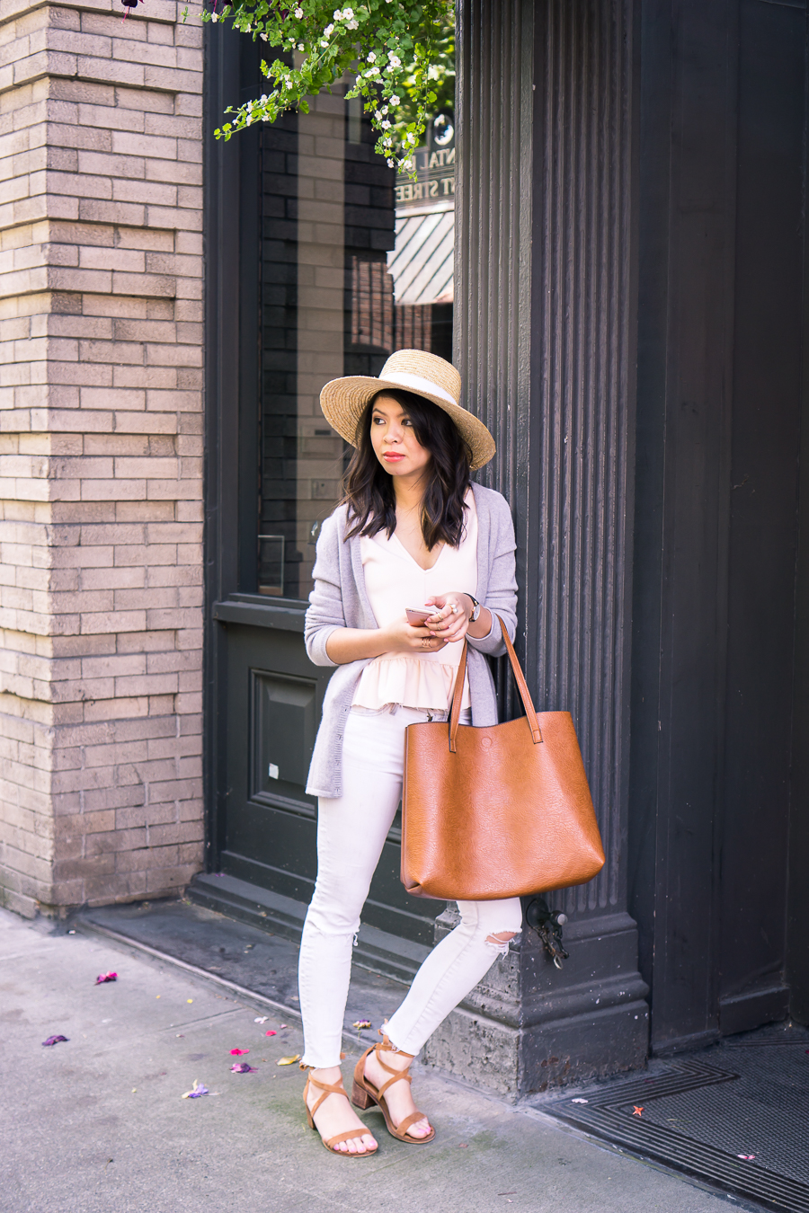 Summer outfit with cashmere cardigan sweater, ruffle tank with raw edge, suede lace up sandals, skinny white jeans, and straw hat | Petite fashion blog