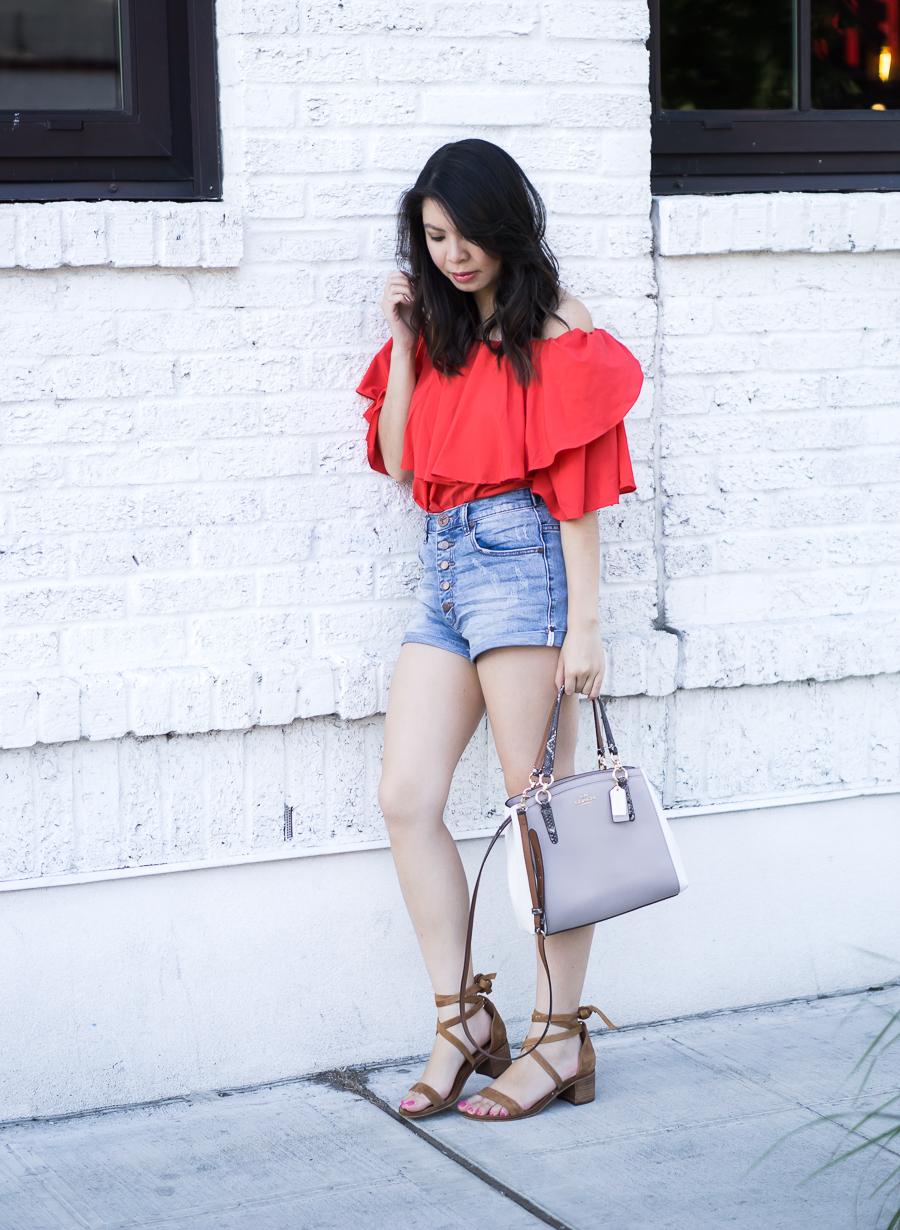 Denim shorts outfit with red off the shoulder top