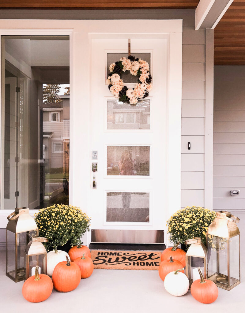 Fall front porch with fall wreath, pumpkins, gold lanterns, Home Sweet Home doormat from Target, Just A Tina Bit Seattle fashion blogger