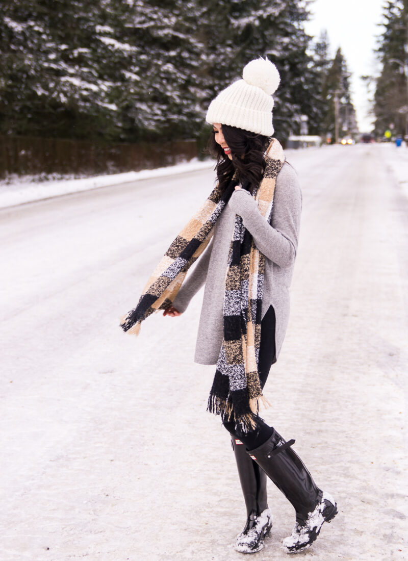 Snow outfits with Hunter boots, grey cashmere sweater, long sweater with leggings, neutral plaid scarf, puffer coat, pom pom beanie, Seattle snow storm, Seattle fashion blogger
