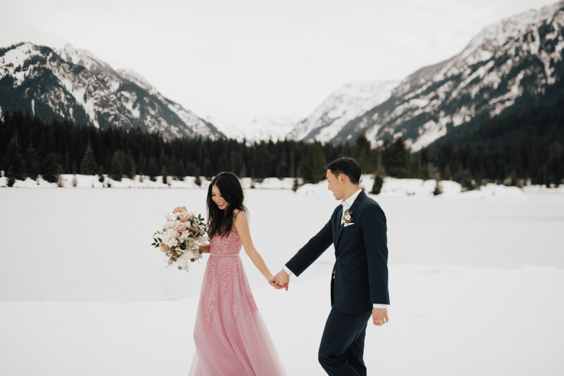 Winter formal engagement photos at Gold Creek Pond in Snoqualmie, Washington, snow photo shoot session, pink blush gown, affordable engagement gown from Amazon, engagement bouquet, engagement shoot outfits