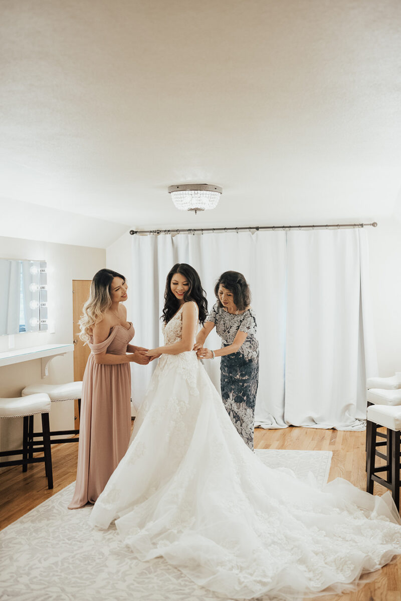 Seattle wedding, wedding outfits, wedding getting ready photos with bride and mother of bride and Matron of Honor. Mother of Bride dress JS Collections Santiago Dress from BHLDN, Calla Blanche Willow dress, wedding dress with dramatic long train