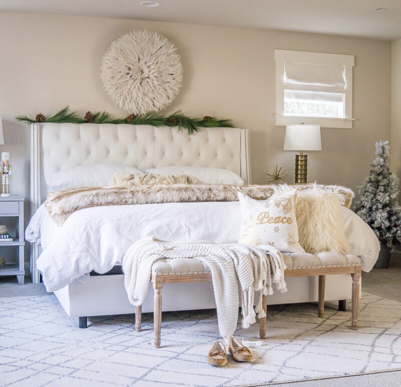 Master bedroom Christmas decorations, white tufted bed, juju hat, garland bed, flocked Christmas tree, holiday home tour, Seattle home decor blogger, neutral bedroom