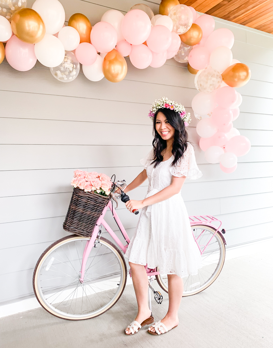 Bridal shower balloon garland, make your own flower crown, pink gold white balloon garland, white eyelet bridal shower dress, pink bike with basket