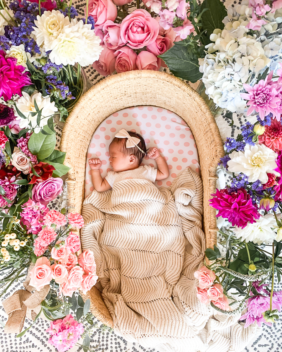 Positive birth story blog, Asian baby, baby in basket surrounded by flowers