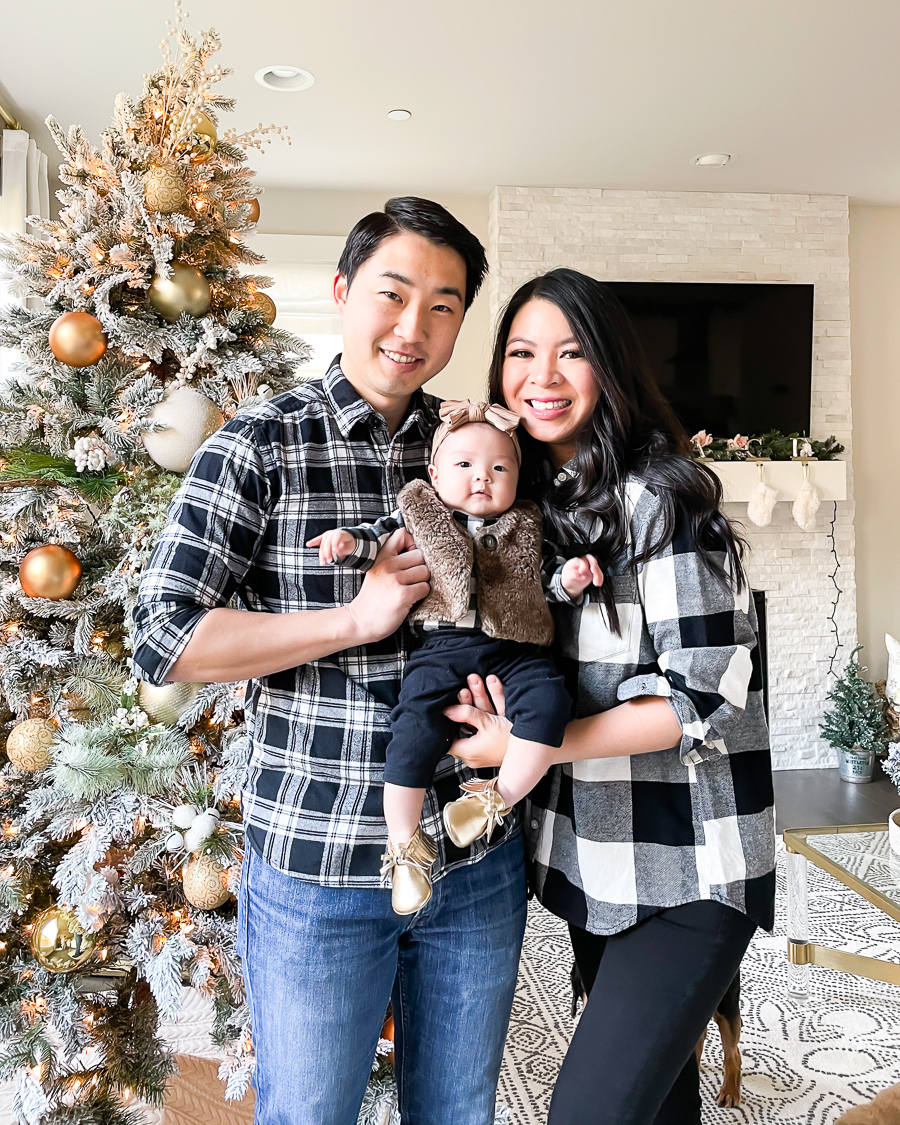 family matching outfits in black and white plaid, newborn baby first Christmas