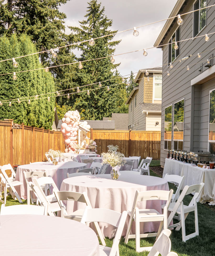 backyard one year birthday party, first birthday party decor, white chairs