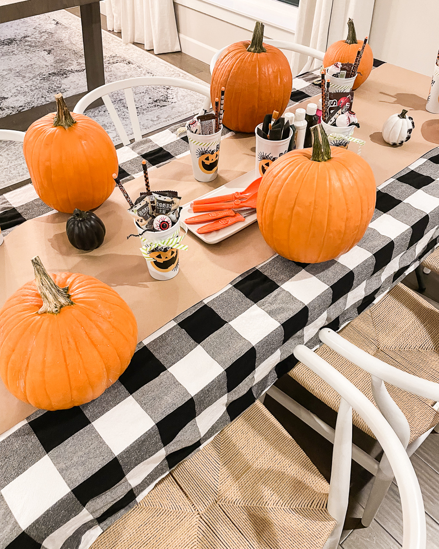 halloween party setup, halloween party inspiration, halloween tablescape, pumpkin carving setup, pumpkin carving party