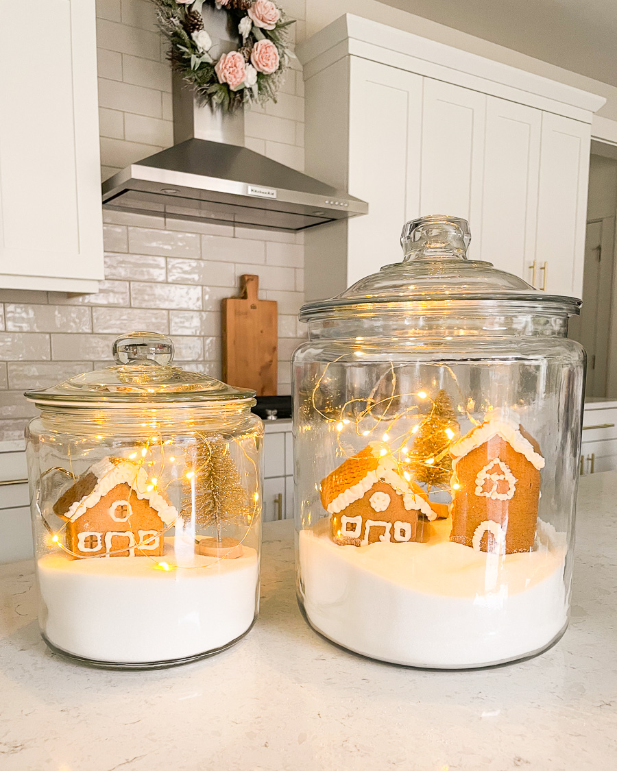 DIY Christmas decor, Christmas village jars, gingerbread house jars, glass jars with twinkle lights, gingerbread house with sugar and fairy lights in glass jars