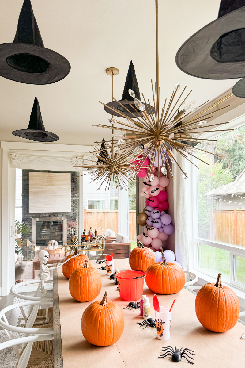 Pumpkin carving table set up in dining room
